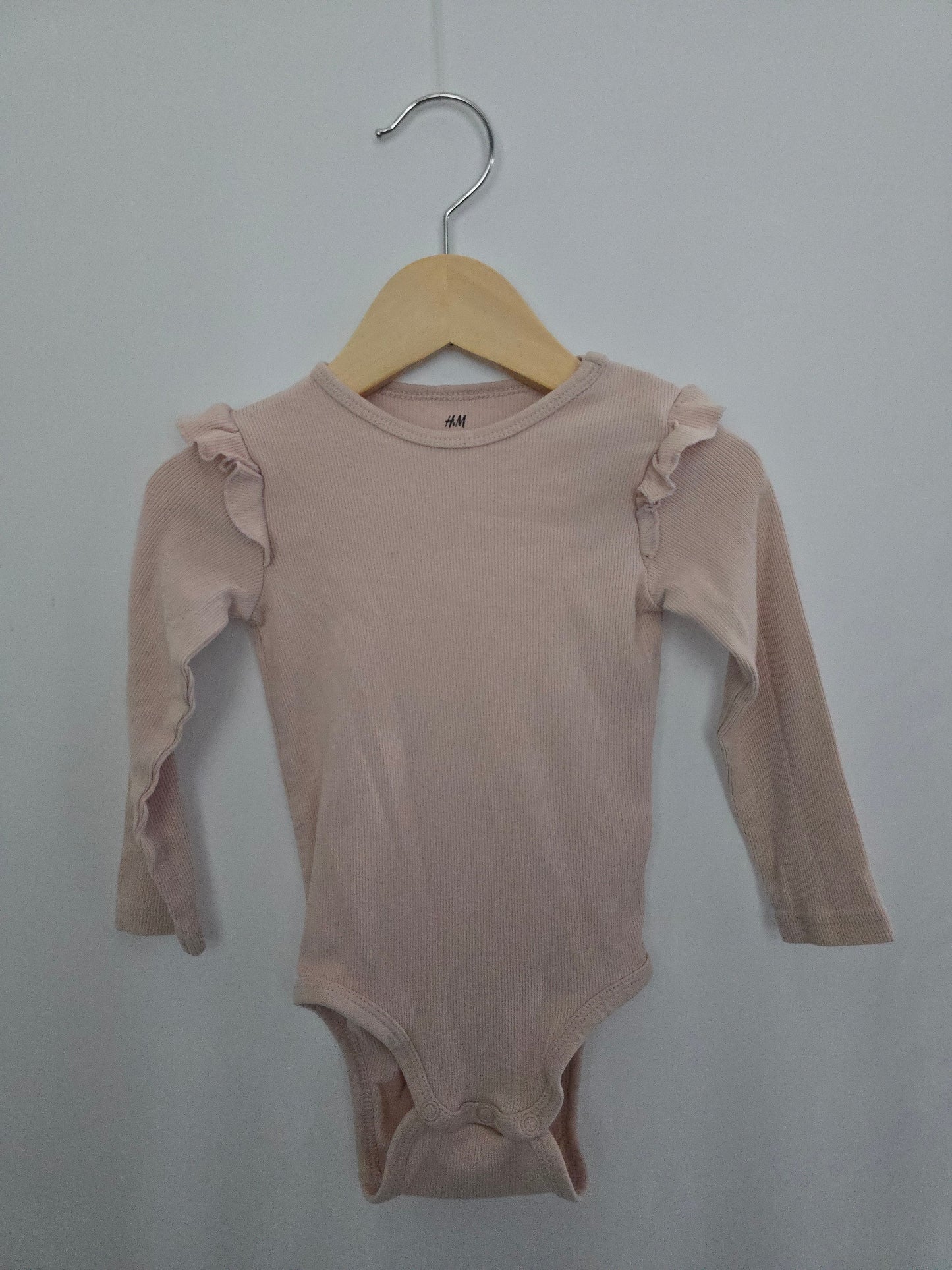H&M Pink Ribbed Ruffle Shoulder Onesie • 9-12 months