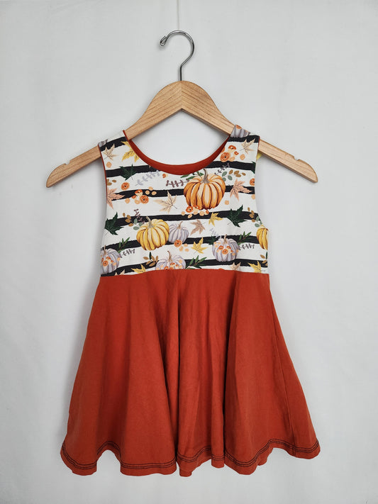 Precious Treasures Pumpkin Peplum Top • 7-8 years