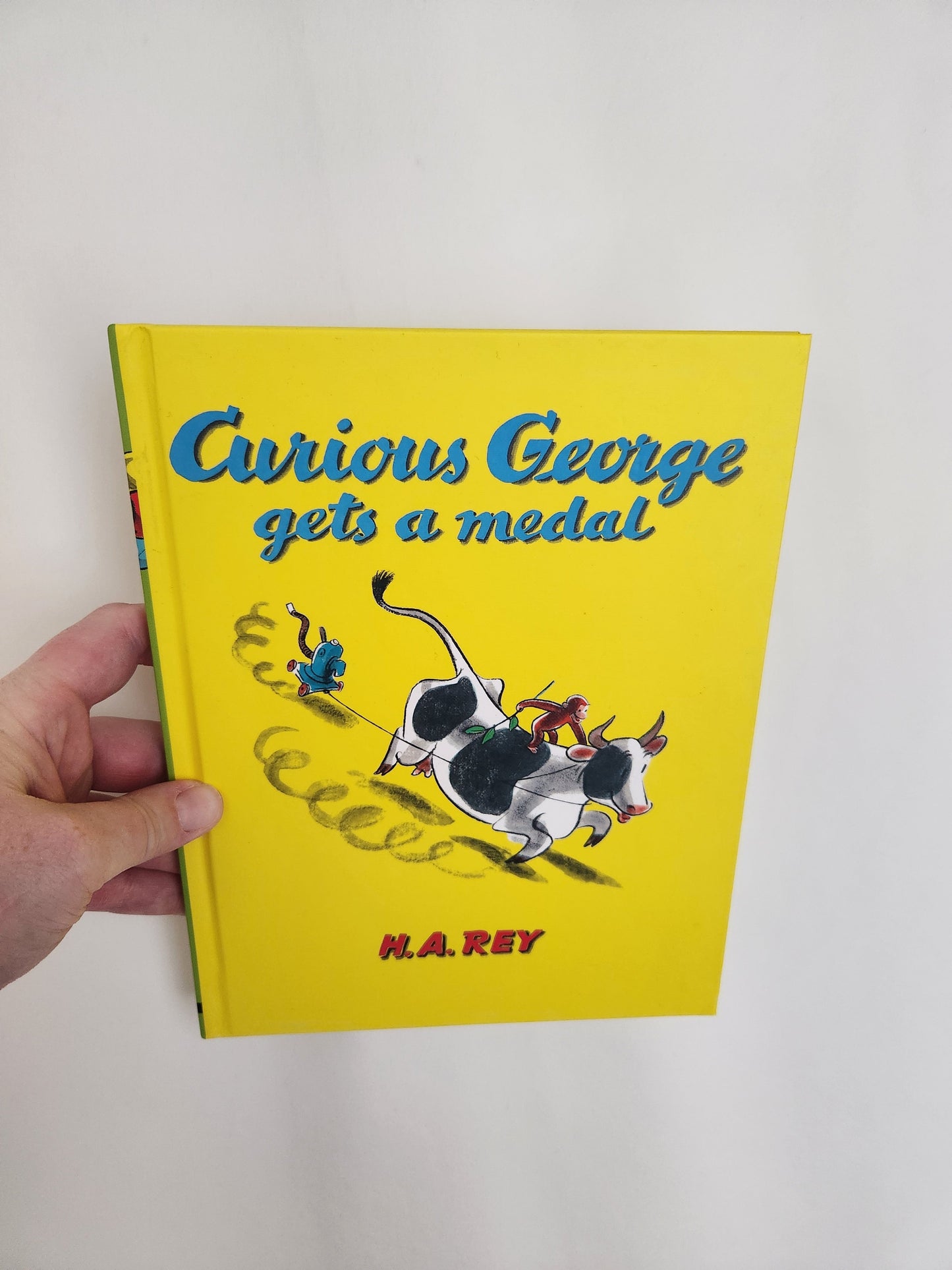 Curious George Gets A Medal • Hardcover Book