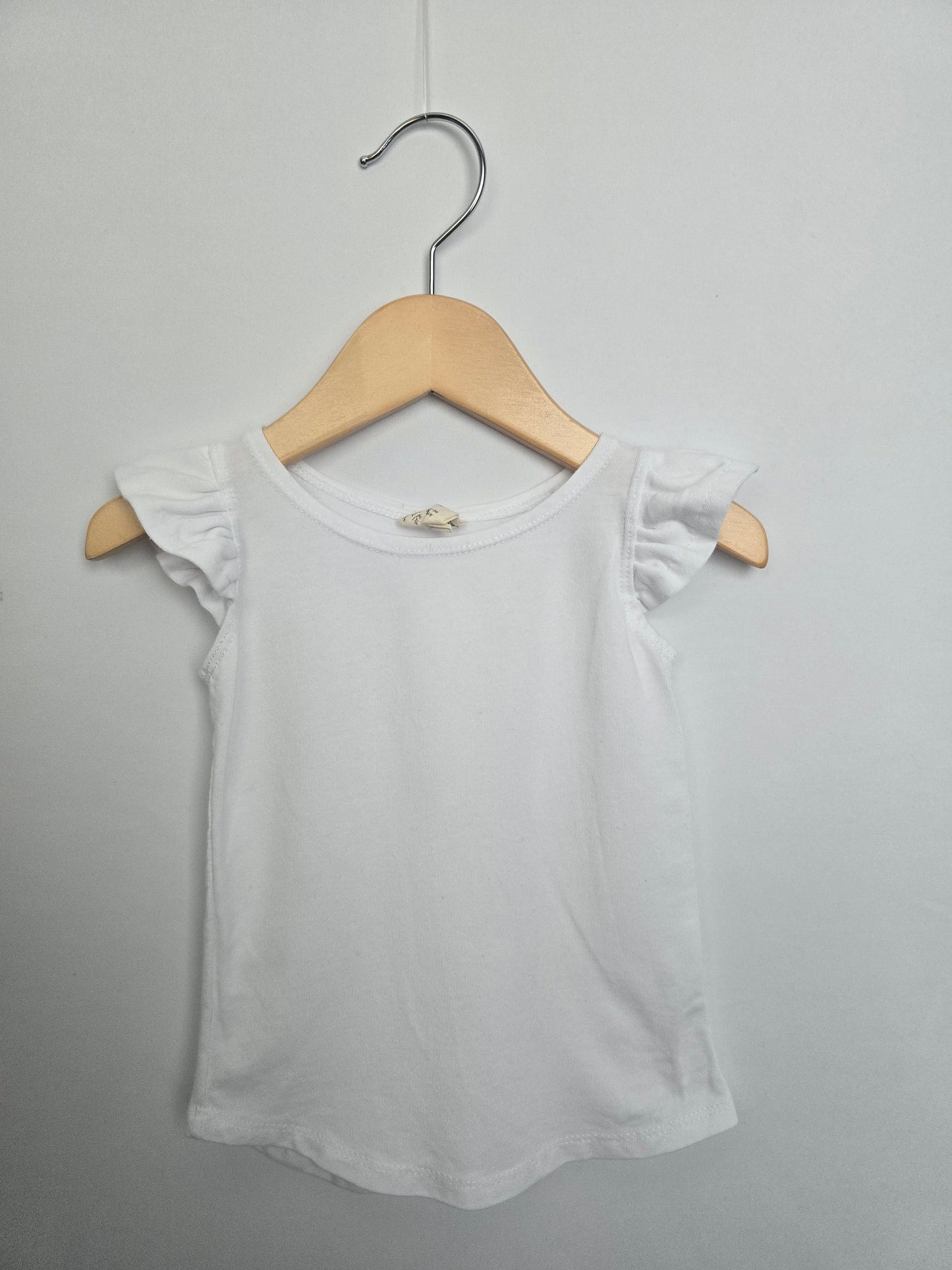 Nest & Nurture White Ruffle Sleeve T-shirt • 2 years