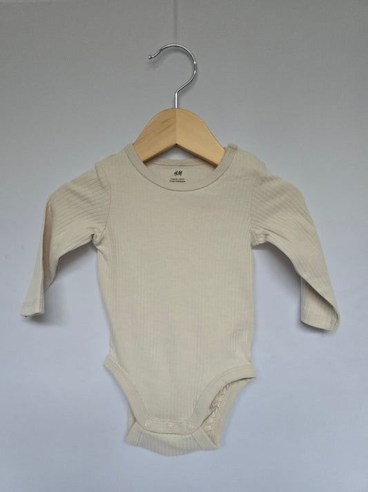 H&M Cream Ribbed Onesie • 2-4 months