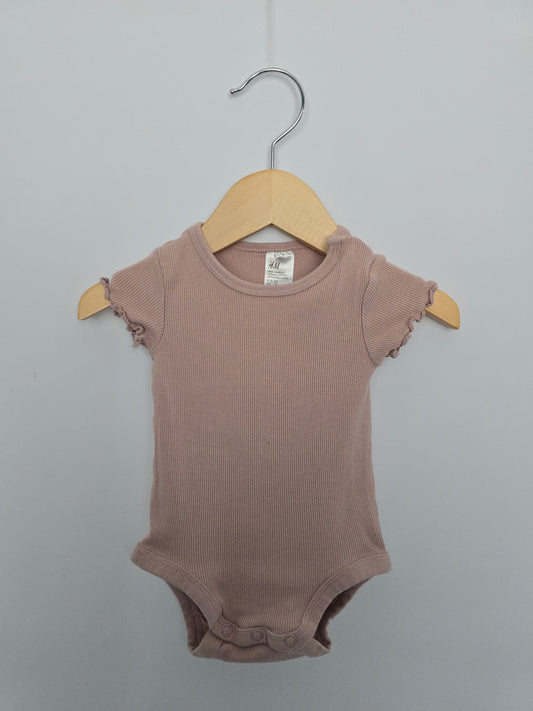 H&M Blush Ribbed Lettuce Sleeve Bodysuit • 2-4 months