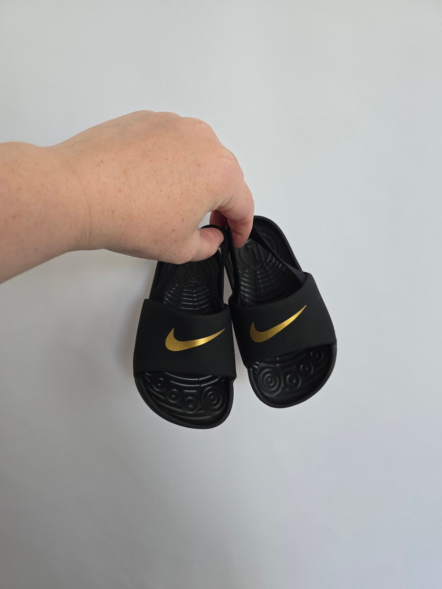 Nike Black & Gold Slides • 7C