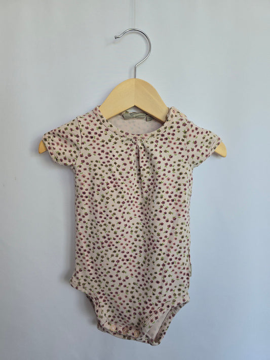 Wheat Pink Floral Bodysuit • 6 months