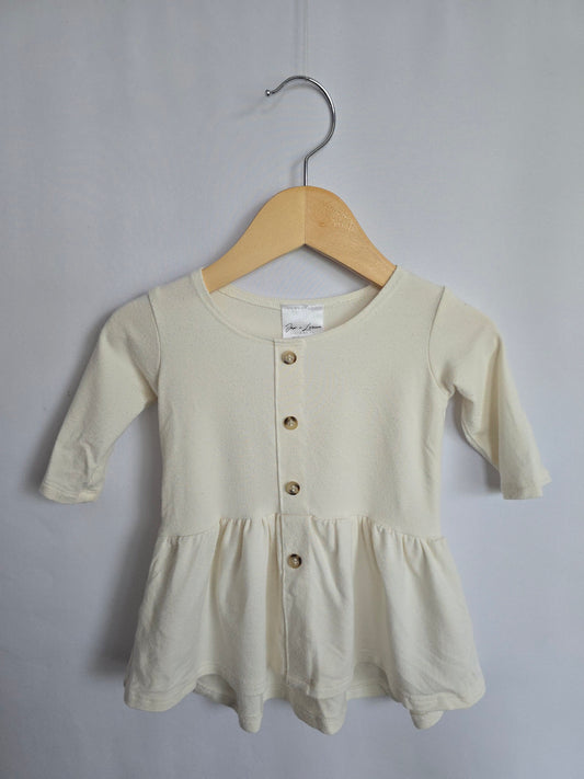 Jax & Lennon Off White Peplum • 0-6 months